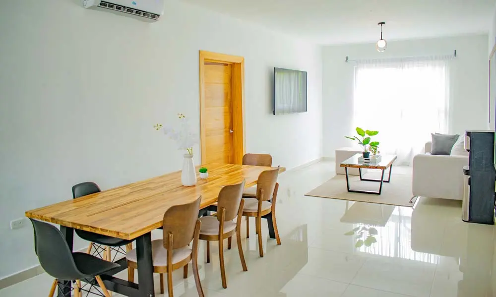 Dining room and living room in the penthouse at Beach Apartamentos in Playa Palmera